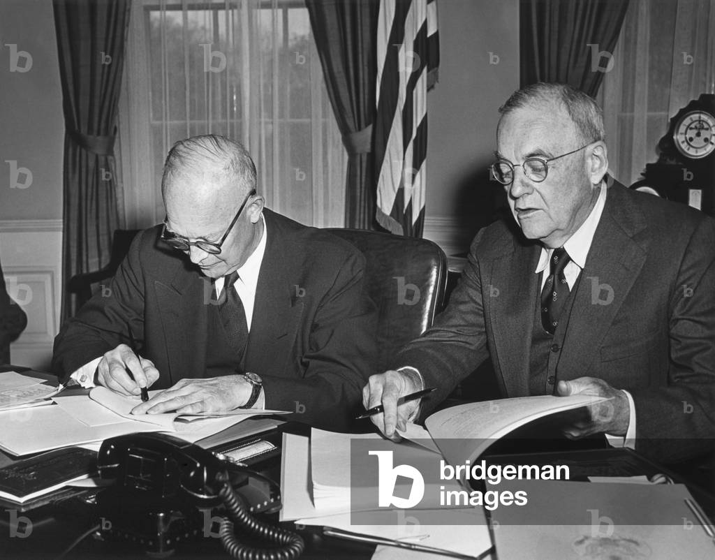 Pres. Eisenhower and John Foster Dulles signing Proclamations of Ratification relating to Germany. April 7, 1955.