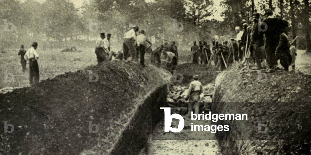 World War 1. After a battle in Northern France, three hundred Germans were buried in one great trench and a similar number of French in another. 1914