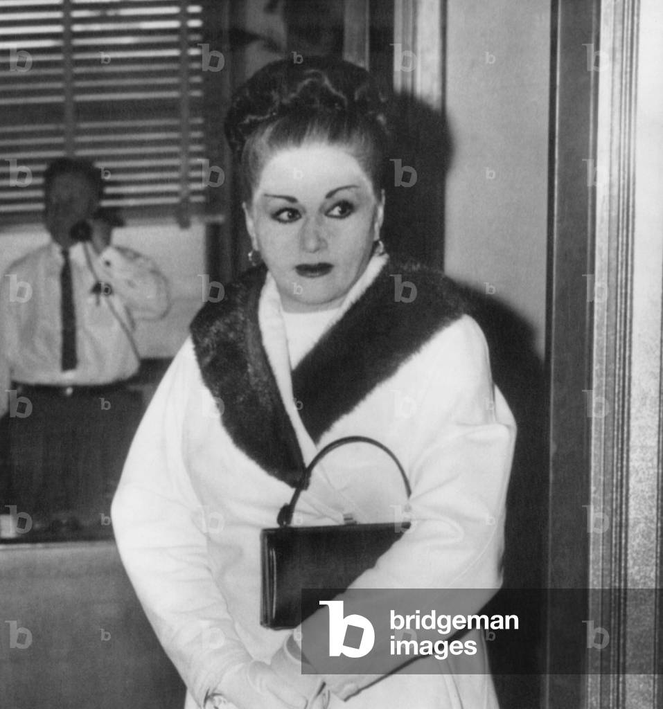 Anna Petillo, estranged wife of racketeer, Vito Genovese, was questioned by Mercer County grand jury. They asked about eight New Jersey men, including her husband, who attended a gangland convention in Apalachin, New York. Dec. 17, 1957