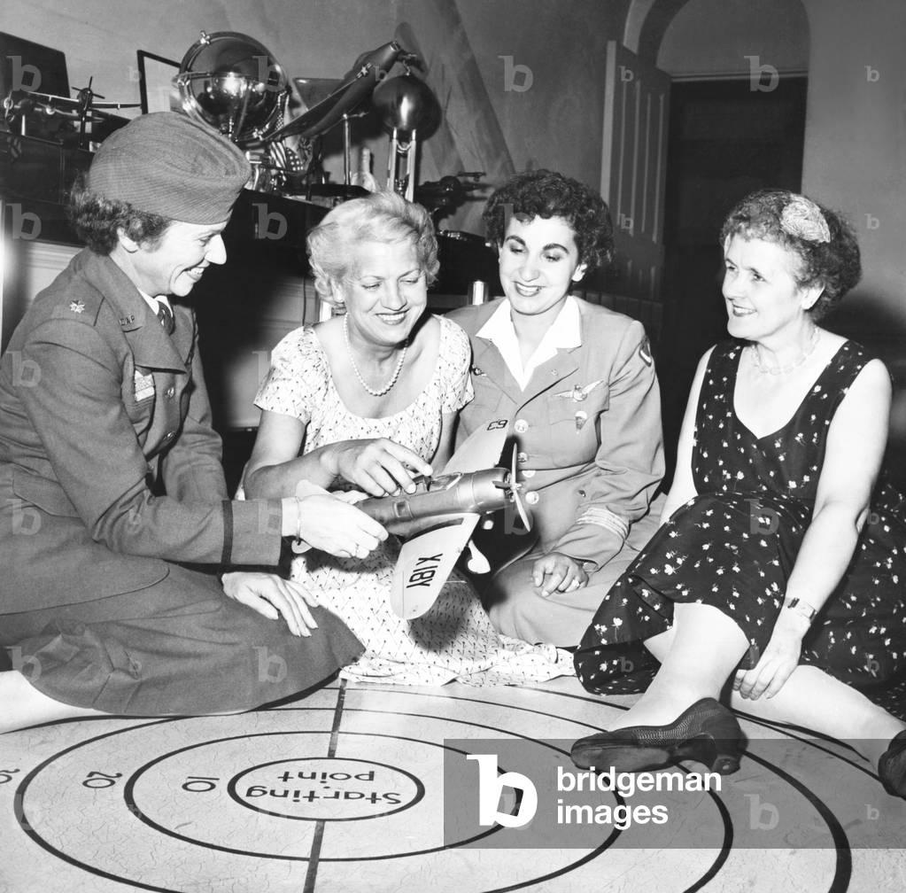 Jacqueline Cochran (2nd from left) and famous women flyers talk shop at her NYC apartment.