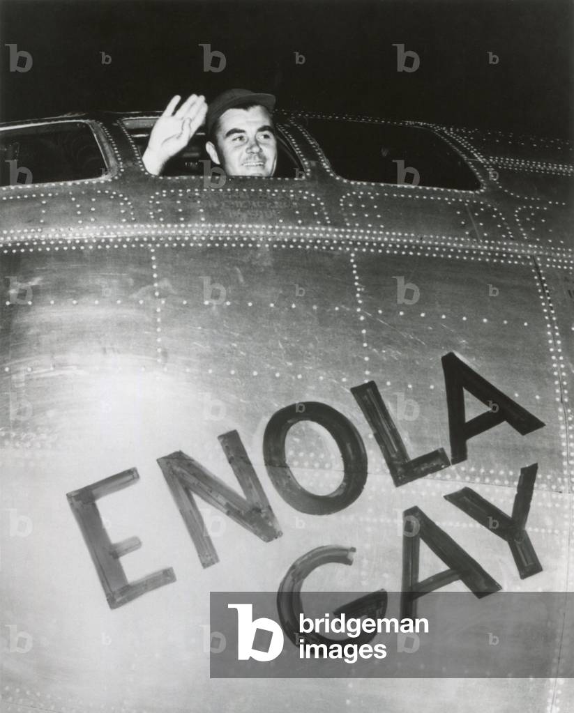 Col. Paul W. Tibbets, Jr., pilot of the ENOLA GAY waves from his cockpit before the takeoff. Several hours later, the B-29 bomber dropped the first atomic bomb on Hiroshima. August 6, 1945. World War 2