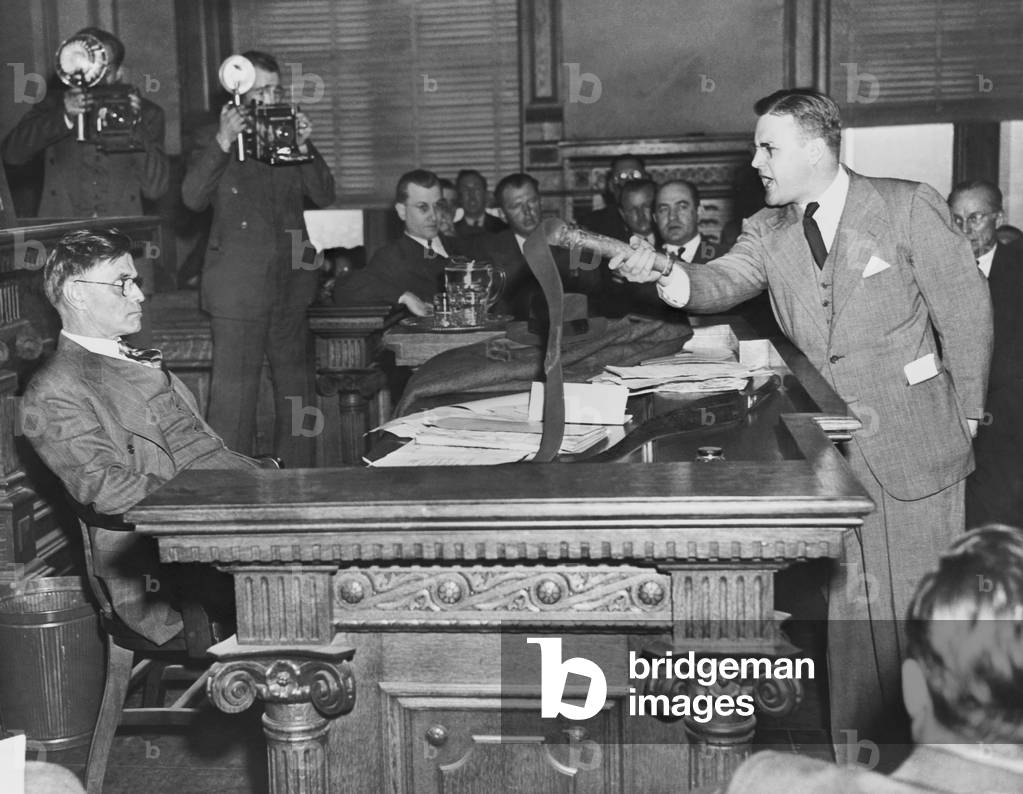 Gov. Eugene Talmadge (left) at a clemency hearing for six East Point Ku Klux Klansmen. Dec. 1, 1941. Prosecutor Daniel Duke brandishes bull whip used on the African American victims. Talmadge, while 'feeling sorry' for the Klansmen, did not grant clemency to the six men serving 1-3 year prison sentences for a series of floggings in suburban Atlanta. Talmadge added he participated in a similar flogging of an African-American man years before