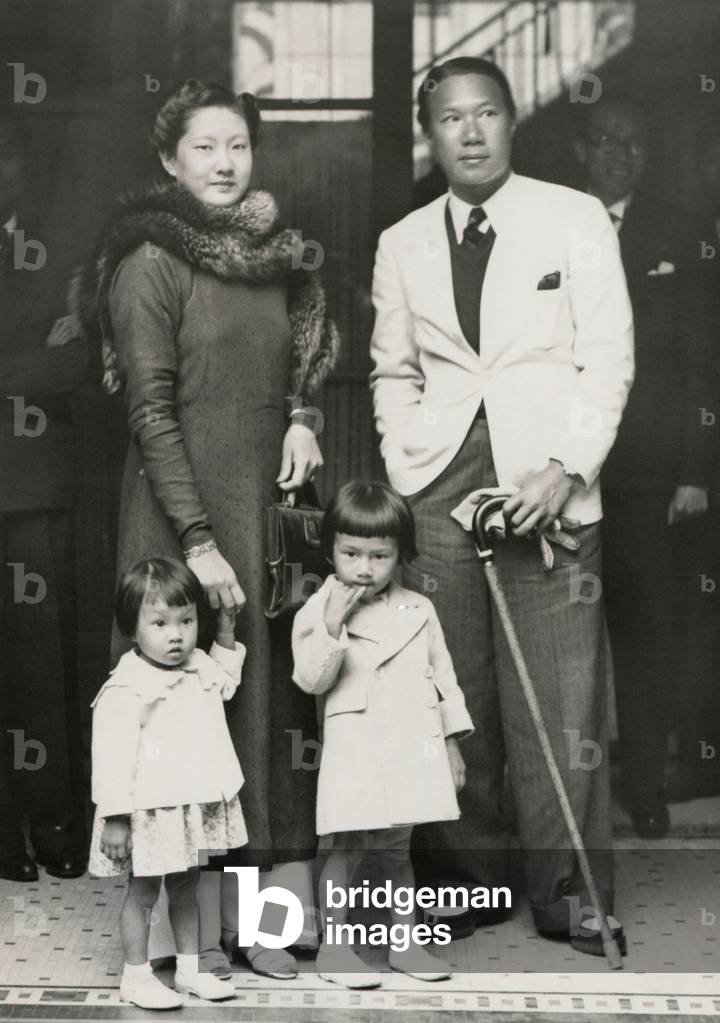Bao Dai, King of Annam (now central Vietnam) with his family in Paris. June 6, 1939. His wife, Nam Phuong was educated in France. Her trousers and embroidered tunics became fashionable in France after her visit.