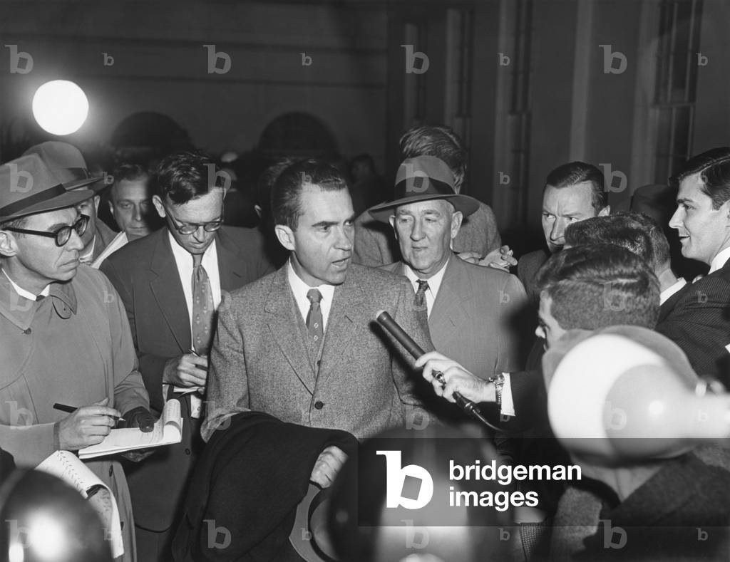 Vice President Richard Nixon with reporters on Nov. 26, 1957. They questioned the VP on Eisenhower's mild stroke of the previous day which left the President with a slight speech impediment.