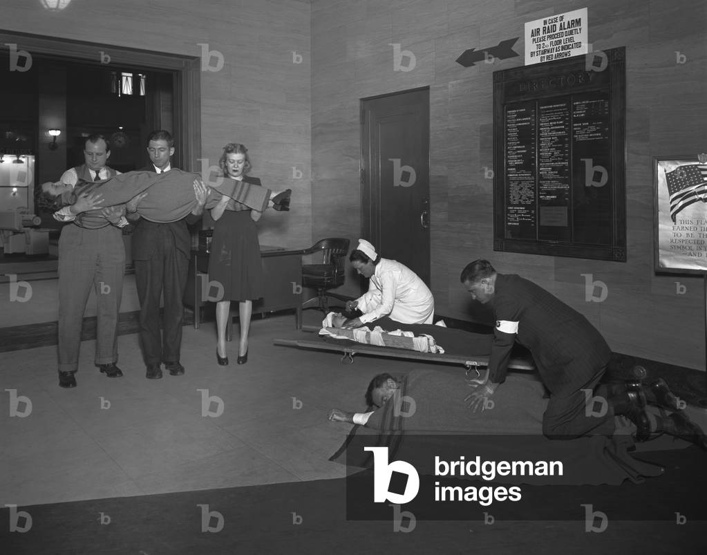 Air raid drill in Washington, D.C. during World War 2. Civil Defense volunteers train in treating the injured. c. 1941-45