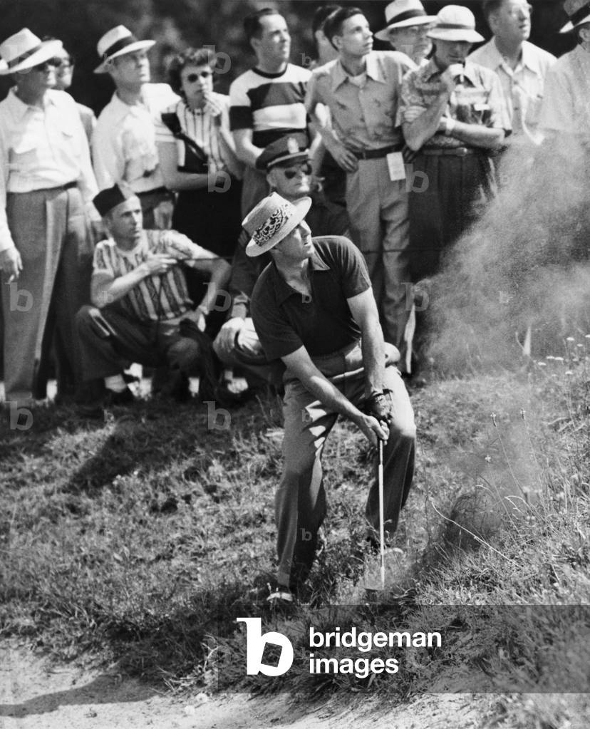 Sam Snead makes an iron shot from the side of a sand trap. Snead won the National PGA championship over Johnny Palmer. Richmond, Virginia. May 31, 1949.