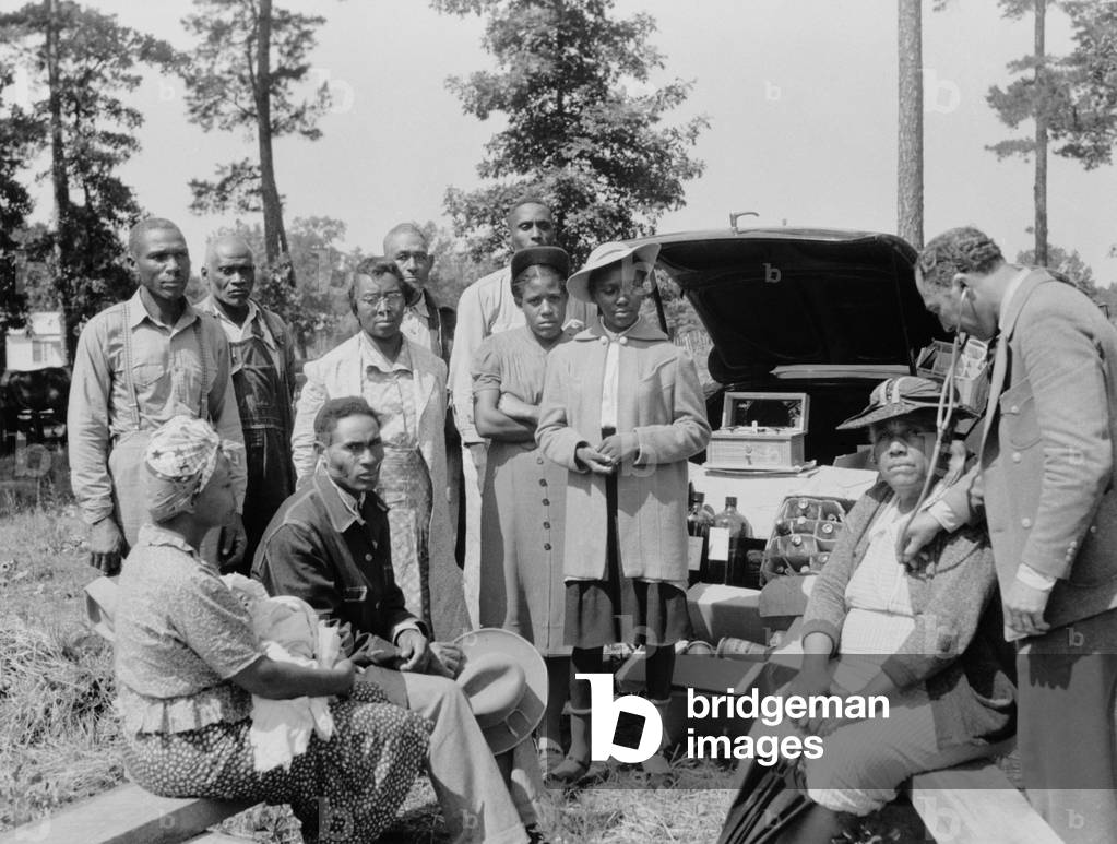 Clinic visit for African American families at Sabine Farms, Marshall, Texas, 1941. Dr. Lee was employed by the Sabine families on a cooperative basis