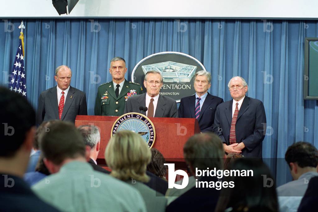 Secretary of Defense Donald H. Rumsfeld center speaks to the press shortly after terrorists crashed American Airlines Flight 77 into the Pentagon on Sept. 11 2001. Behind Rumsfeld are Sec. Thomas E. White Gen. Henry H. Shelton Senators John Warn, Photo by:Everett Collection