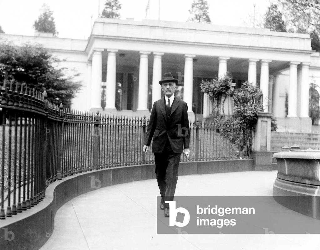 Andrew Mellon (1855-1937), industrialist and politician, then secretary of the Treasury, walking near the White House during the Harding Administration. 1921