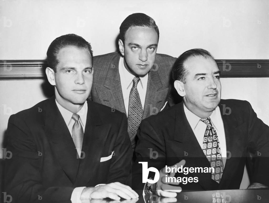 David Schine (left), Roy Cohn, and Senator Joseph McCarthy (right) in 1953. McCarthy headed the Senate Permanent Subcommittee on Investigations. Cohn was his Chief Counsel, and Shine was an unpaid Chief Consultant. They were attending a subcommittee hearing in New York