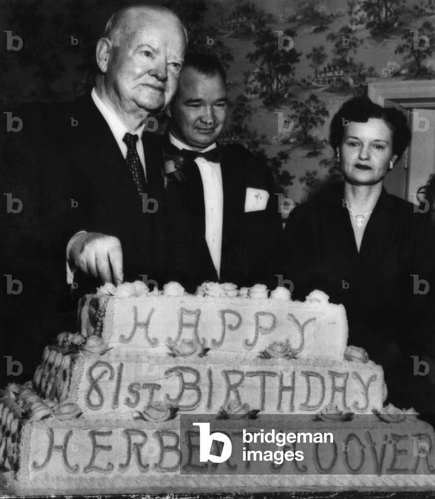 Former President Herbert Hoover (left), celebrates his 81st birthday, and dedicates his boyhood home in Newberg, Oregon as a national shrine, Mr. and Mrs. Clayton Black, bakers of the cake, stand beside him, August 10, 1955