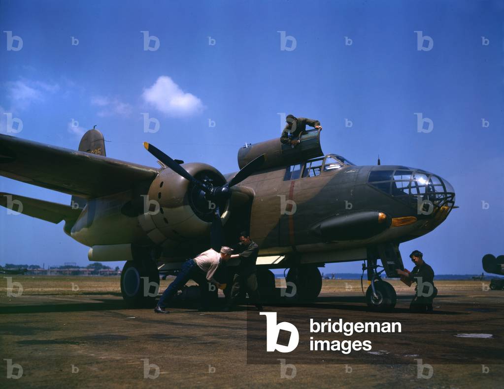World War II, servicing an A-20 bomber, photograph by Alfred T. Palmer, Langley Field, Viginia, July, 1942