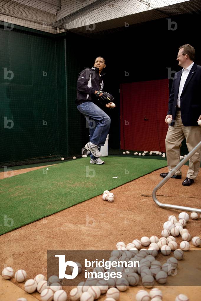 President Barack Obama practices before throwing out the first pitch with St. Louis Cardinals first baseman Albert Pujols not pictured before the start of the Major League Baseball All-Star Game in St. Louis on July 14 2009.,