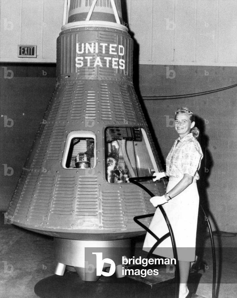 Astronaut Trainees Jerrie Cobb stands next to a Mercury spaceship capsule. Cobb passed all the training exercises, ranking in the top 2% of all astronaut candidates of both genders. After three years, Cobb left NASA for the jungles of the Amazon, where she has spent four decades as a solo pilot delivering food, medicine, and other aid to the indigenous people