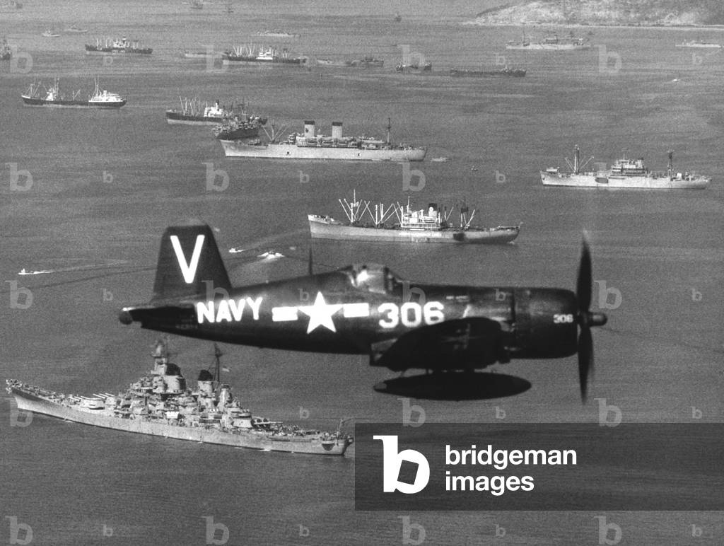 The UN assault Force in Inchon Harbor, Sept. 15, 1950. 70,000 troops would invade 150 miles behind North Korean lines and advance to Seoul. Below the Vought F4U-4B Corsair fighter is the battleship USS Missouri. Korean War, 1950-53