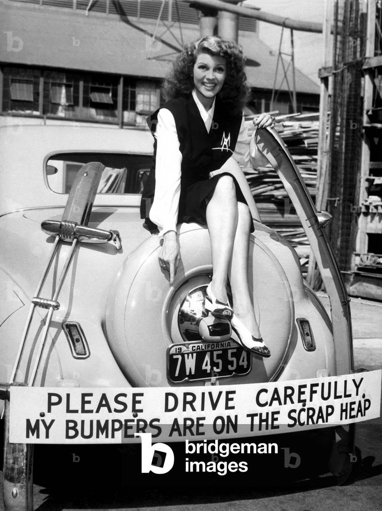 Movie star Rita Hayworth sacrificed her bumpers for World War 2 scrap metal drive. 1942