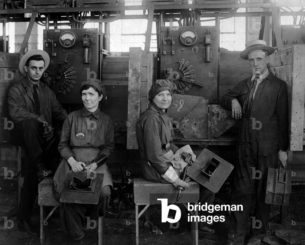 These women electric welders are the first women working on actual ship construction, in the United States. Hog Island shipyard, Philadelphia, Pennsylvania. World War I. c. 1918