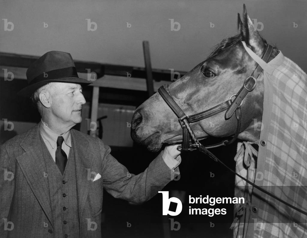 Charles Howard admiring his horse Seabiscuit, March 5, 1940. Seabiscuit had just won the Santa Anita Handicap.
