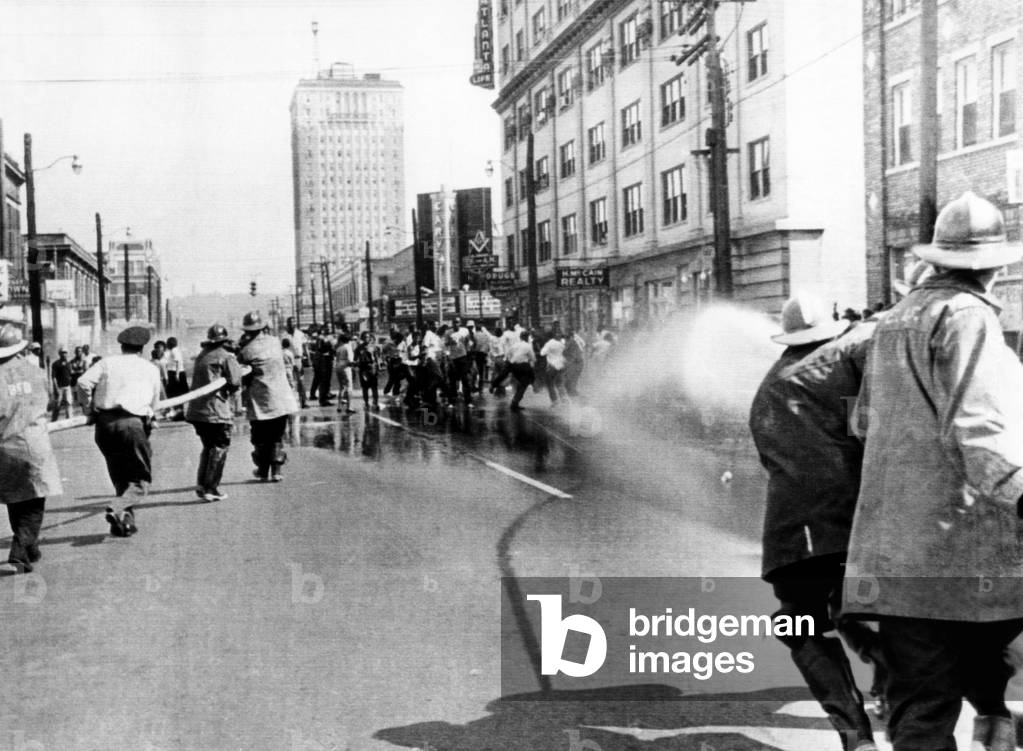 Firemen use hoses to disperse a civil rights demonstration in Birmingham, 1963