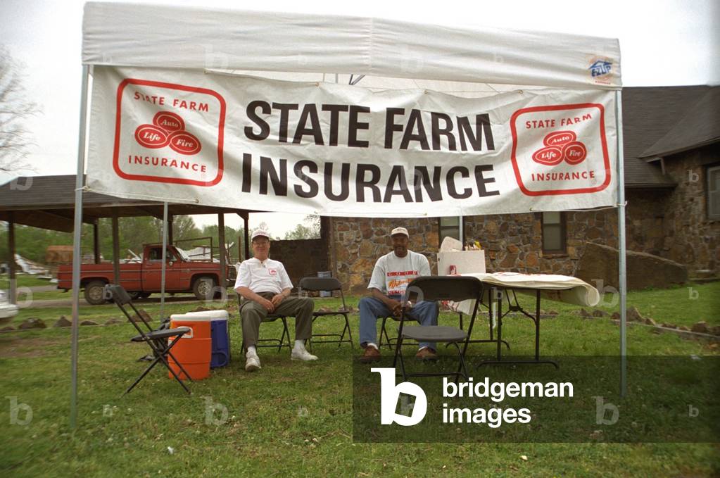 State Farm Insurance set up an outdoor office in Dade County to assist customers after Hurricane Andrew. State Farm was the largest insurer in southern Florida serving 20 of the home and car owners. Eventually many insurance companies were bankrupted and others were stressed by covering their customers' losses. Sept. 1992