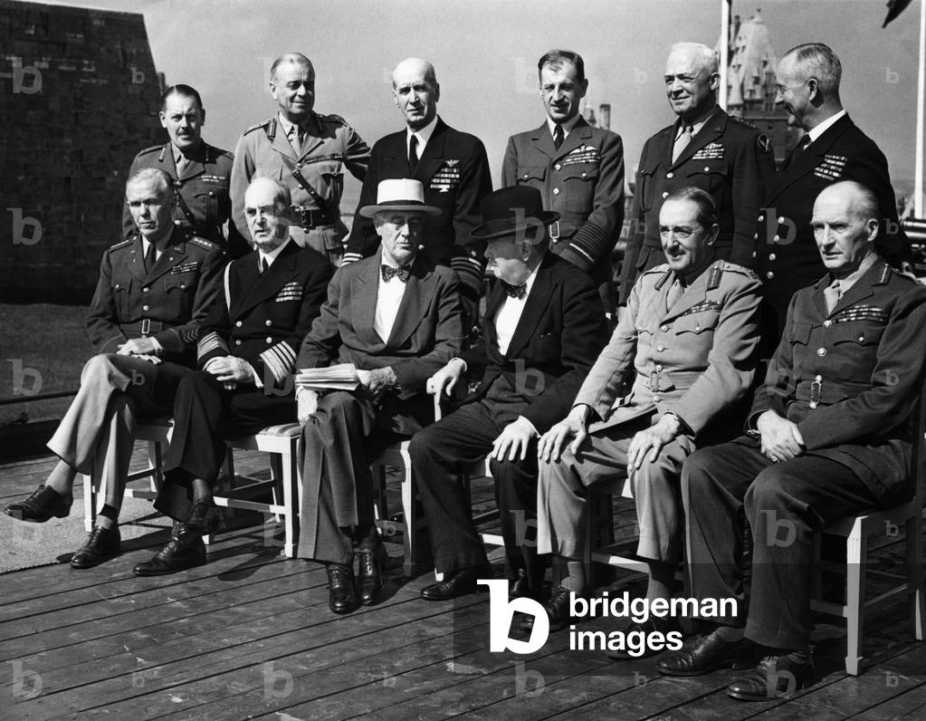 World War II. Seated, from left: George Marshall, William Leahy, Franklin Delano Roosevelt, Winston Churchill, Alan Brooke, John Dill. Standing, from left: Roger Hollis, Hastings Ismay, Ernest King, Charles Portal, Henry Arnold, Andrew Cunningham, at the Second Quebec Conference, (codenamed OCTAGON), Quebec City, Canada, September 1944
