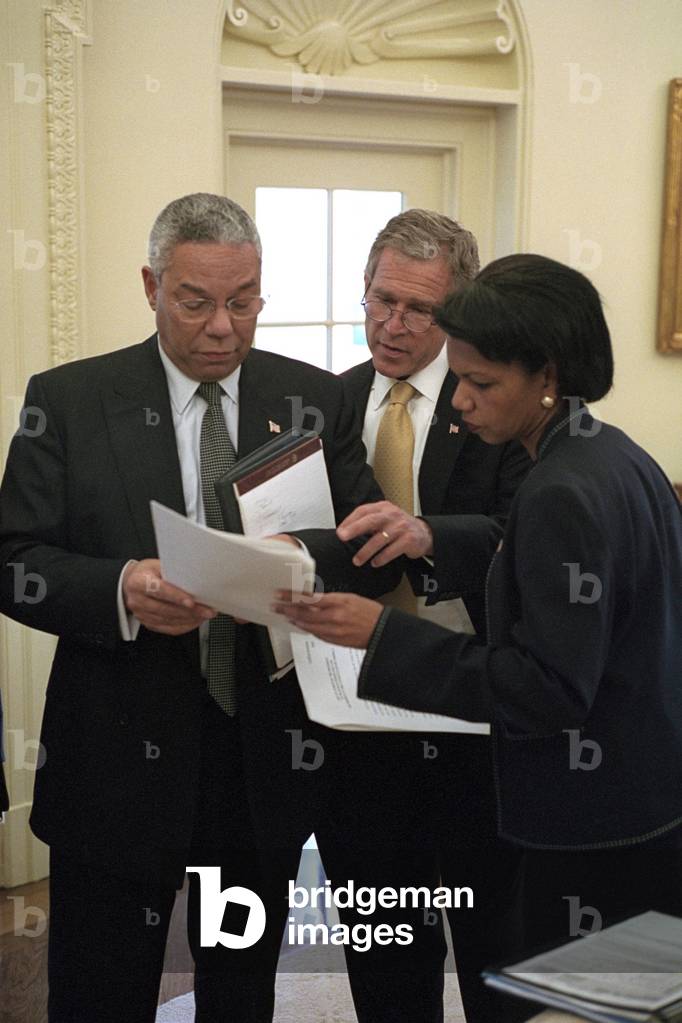 President George W. Bush prior to meeting with the Russian Foreign Minister, Sept. 19, 2001. Bush 43 with Sec. of State, Colin Powell, and National Security Adviser, Condoleezza Rice