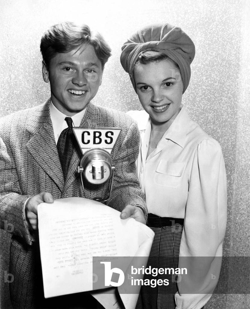 Judy Garland and Mickey Rooney appear on Columbia network's premiere broadcast of 