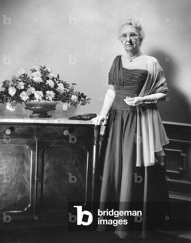 Mamie Eisenhower's mother, Mrs. Elivera Doud, in the gown she will wear to the 1957 Inaugural Ball. Jan. 19, 1957.