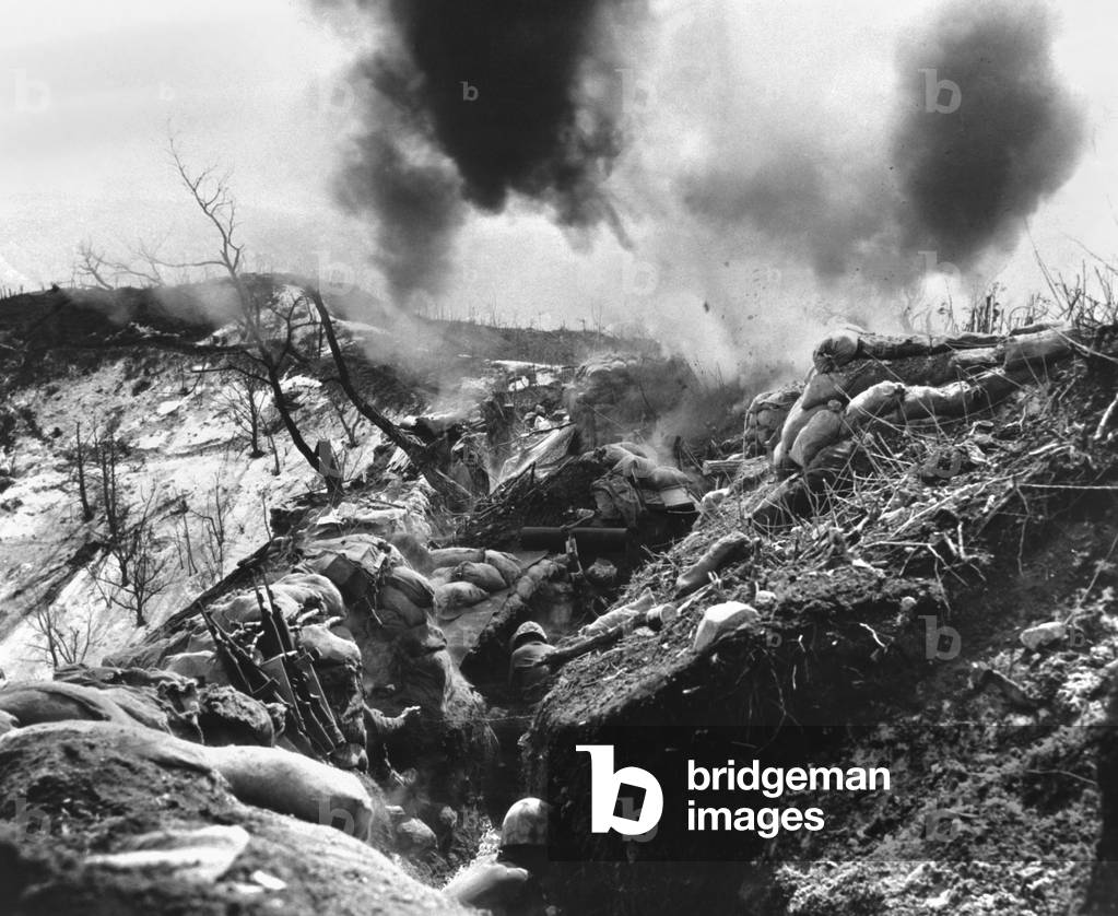 U.S. Marines take cover in a deep trench as Red mortar shell lands nearby. May 12, 1952. The last two years of the Korean War, after armistice talks were started, became a stalemate along the 38th parallel. Without movement, entrenched positions developed, reminiscent of the World War 1
