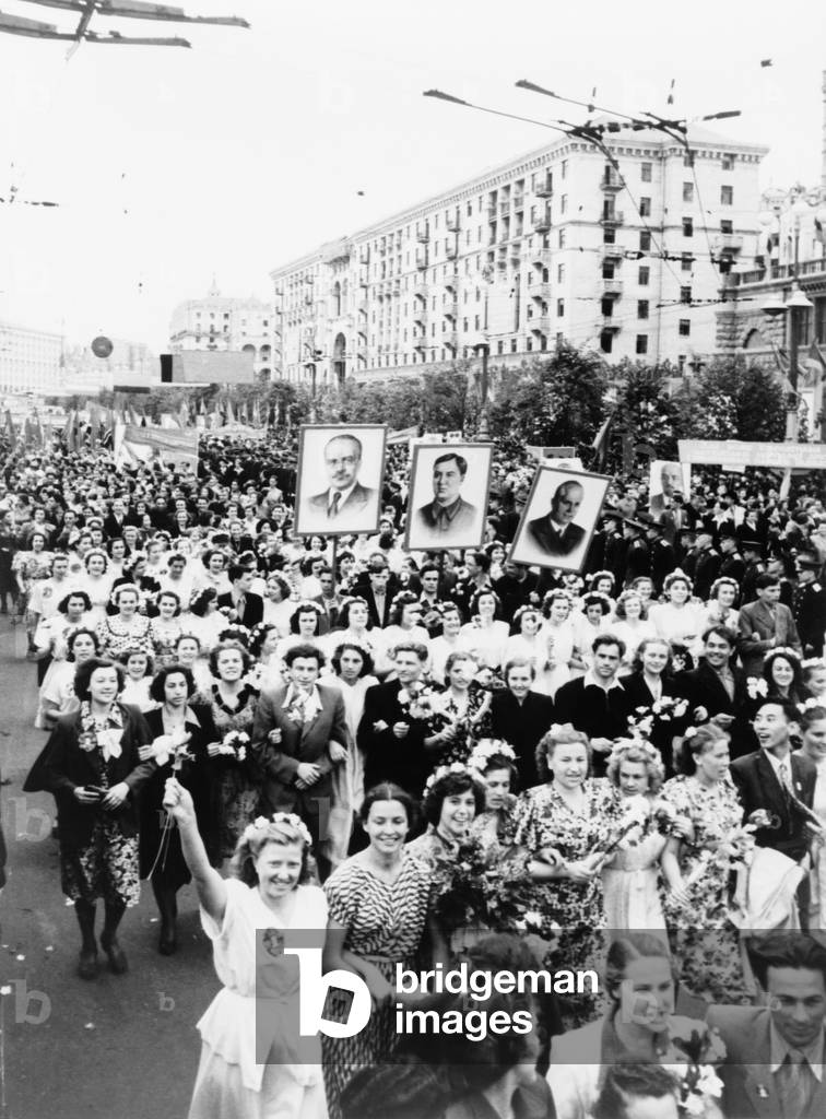 People of Kiev at a demonstration to honor the tercentenary (300th aniversary) of the union of the Ukraine with Russia in 1954. Portraits of Molotov(left) and Nikita Khrushchev (right) are carried by marchers