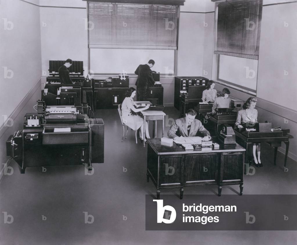 Mid-century state of the art IBM computers with punch-cards and sorters. IBM (International Business Machines) lead the development of tabulators, or mechanical computers for business use. c. 1950
