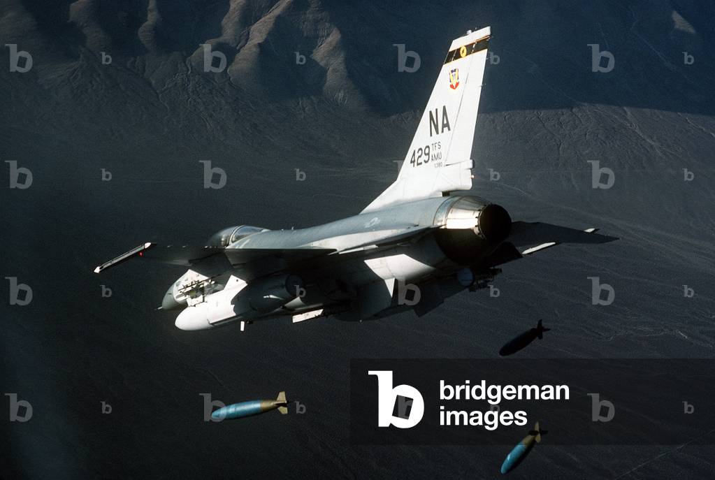 F-16 Fighter releasing three 2000-pound bombs. Feb 1 1987