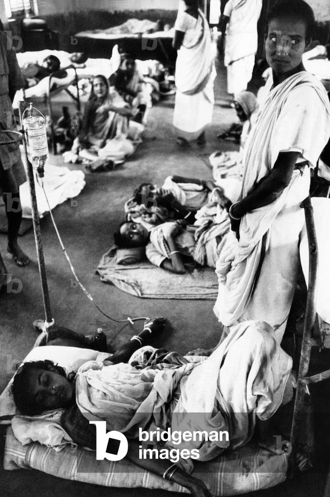 A women refugee from the Bangladesh Liberation War. She receives intravenous medicine in the Bongaon Subdivision Hospital near Calcutta. Nov. 1971