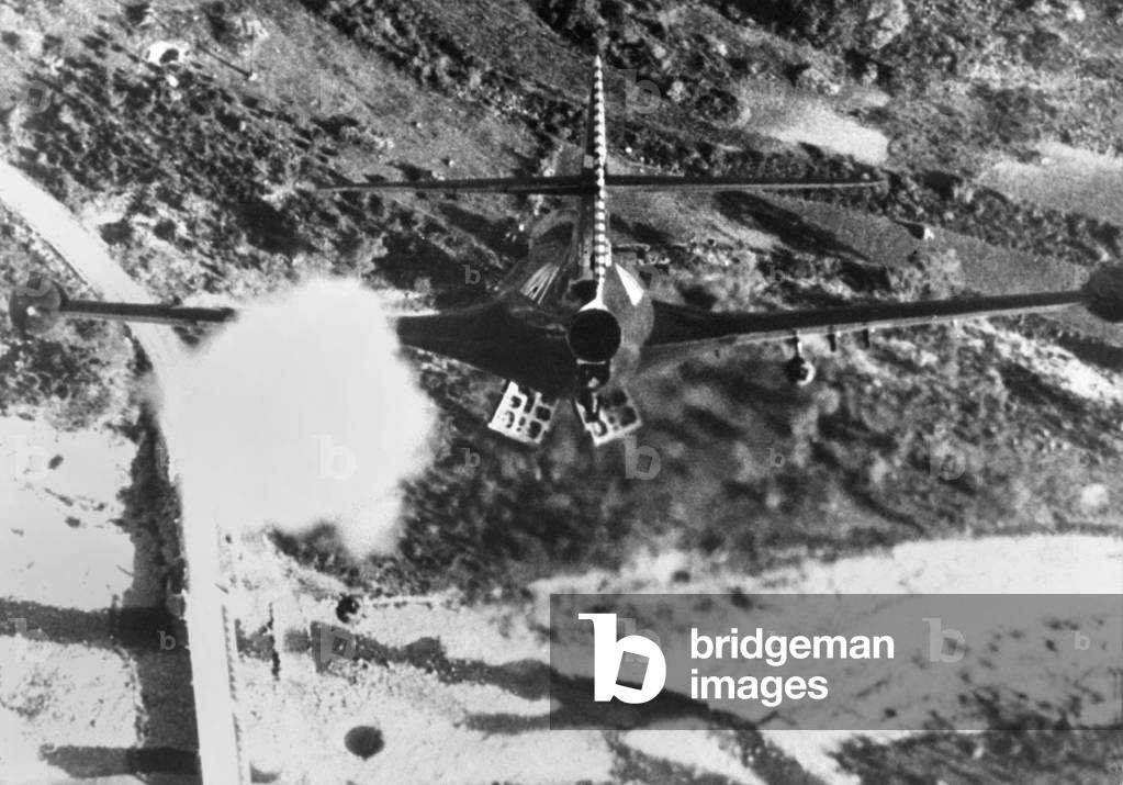 F-84 Thunderjet from the USS Bon Homme Richard, is shown rocketing and bombing Korean bridge. Nov. 11, 1952 during the Korean War