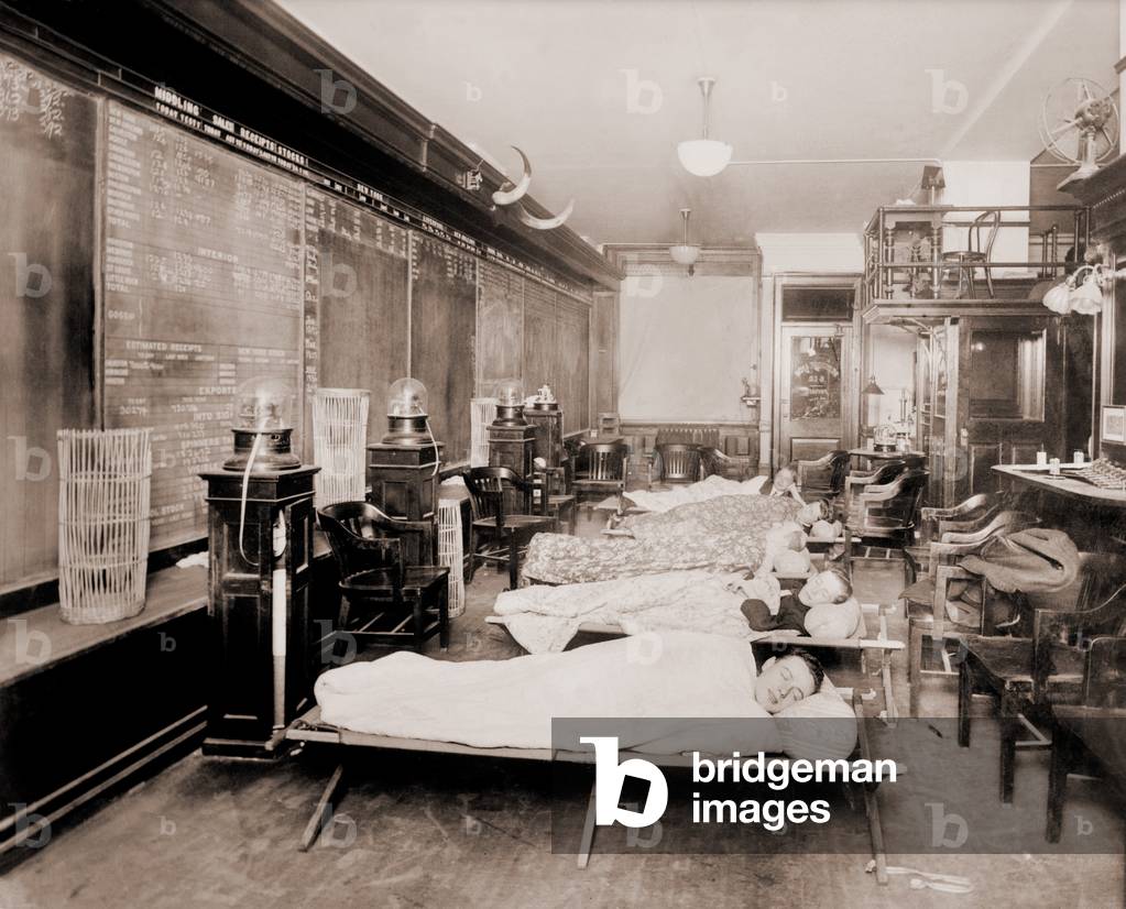 Wall Street clerks sleeping in office due to excessive work caused by heavy stock trading. New York City, October 23, 1915