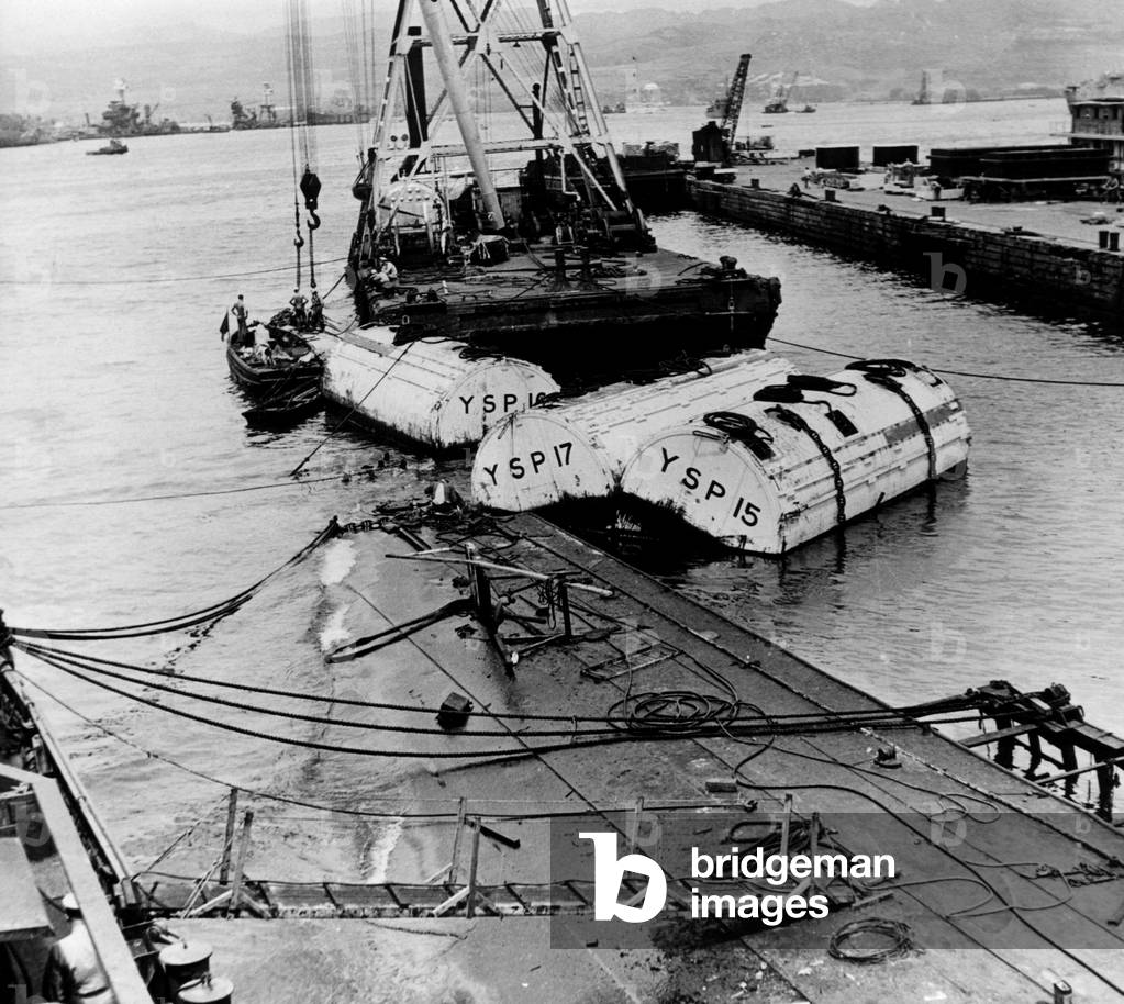 The raising of the USS Oglala, a minelayer sunk by the Japanese in the December 7th attack on Pearl Harbor, May, 6, 1942