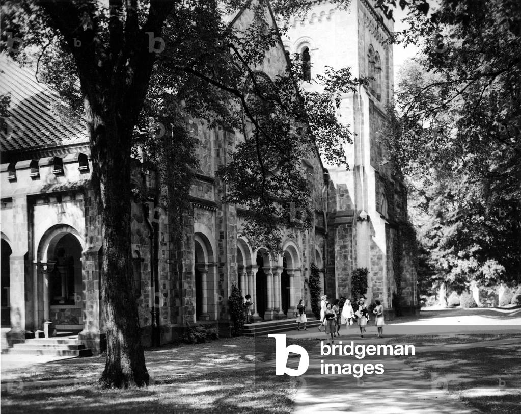 VASSAR UNIVERSITY CHAPEL, students coming outh of the chapel after the weekday morning service. Undated photo
