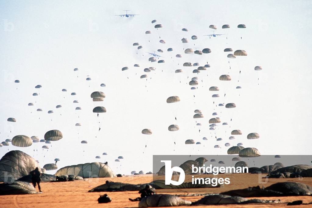 Paratroopers from the 82nd Airborne Division land at Palmerola Air Base in Honduras. Honduran and U.S. Army Special Forces conducted exercises to counter Nicaragua's attempts to raid Contra safe havens in Honduras. Jan. 1.1988., Photo by:Everett Collection