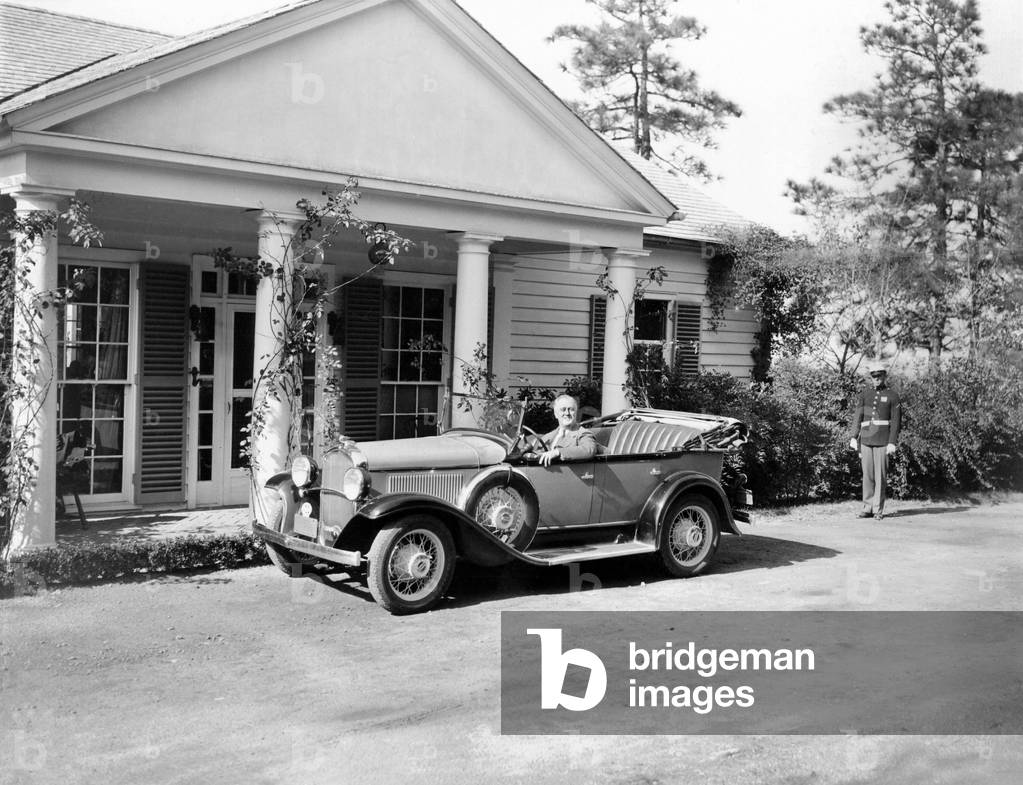 President Franklin Roosevelt in his specialized car at his vacation cottage at Warm Springs, Georgia where he spent the Thanksgiving holiday. Nov. 23, 1935