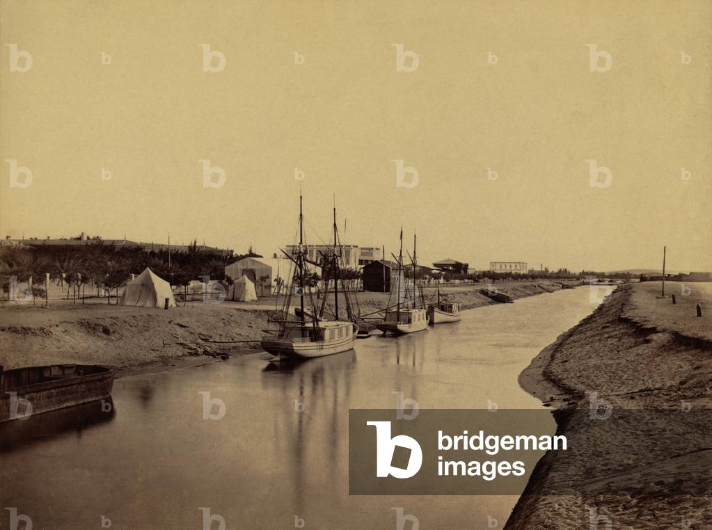 Small boats moored at water's edge to the Suez Canal at Ismailia. The Ismailia segment of the modern canal was completed in November 1862. 1860 photo by Francis Frith. LC-DIG-ppmsca-04470