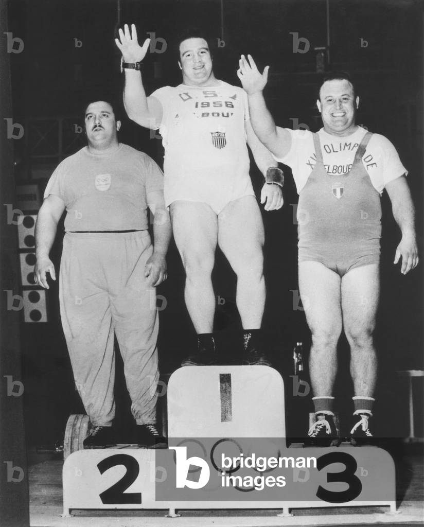 Paul Anderson (center) won a Olympic Gold Medal in heavyweight weightlifting. Melbourne, Australia Games, Nov. 26, 1956. At left is Argentina's Humberto Silvetti, who won the Silver Medal. Alberto Pigaiani of Italy won the Bronze