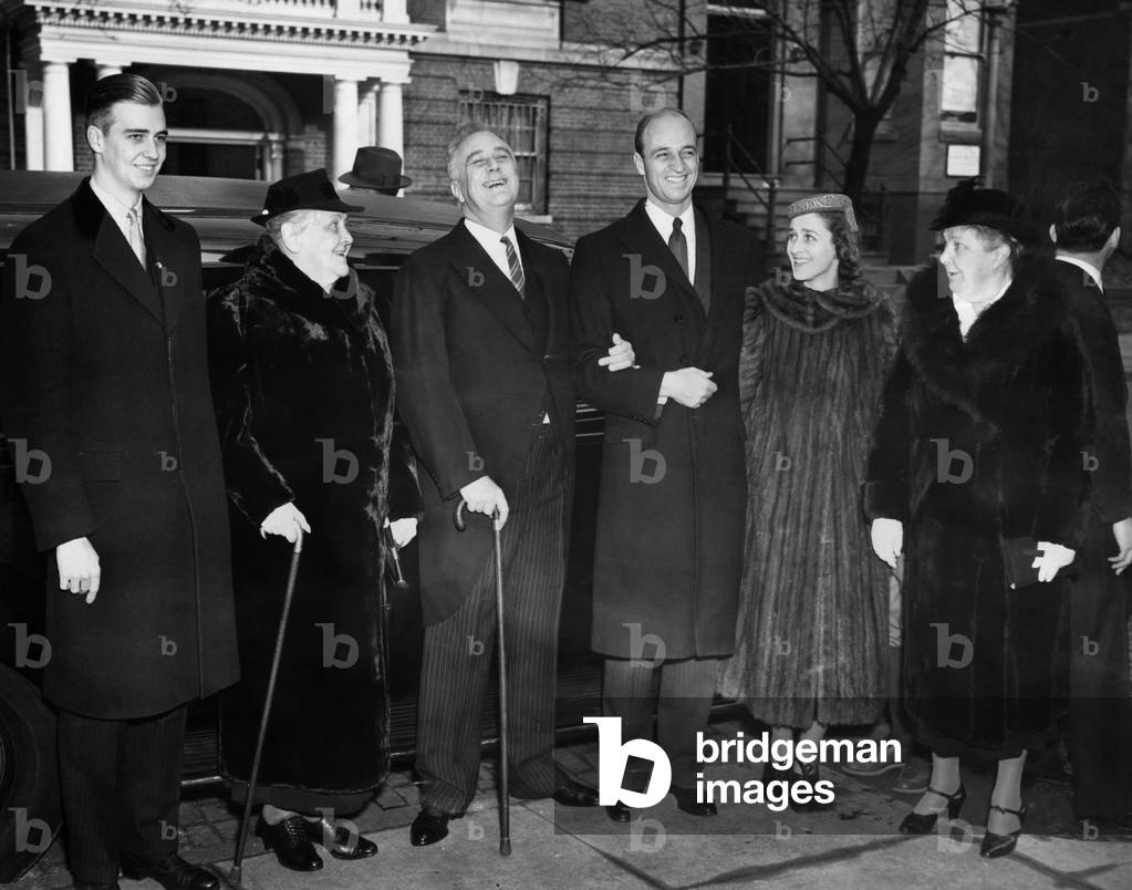 FDR Presidency. From left: John Roosevelt, Sara Roosevelt, US President Franklin Delano Roosevelt, James Roosevelt, Betsey Cushing Roosevelt, attending Christmas Day services, Washington, D.C., December 25, 1937