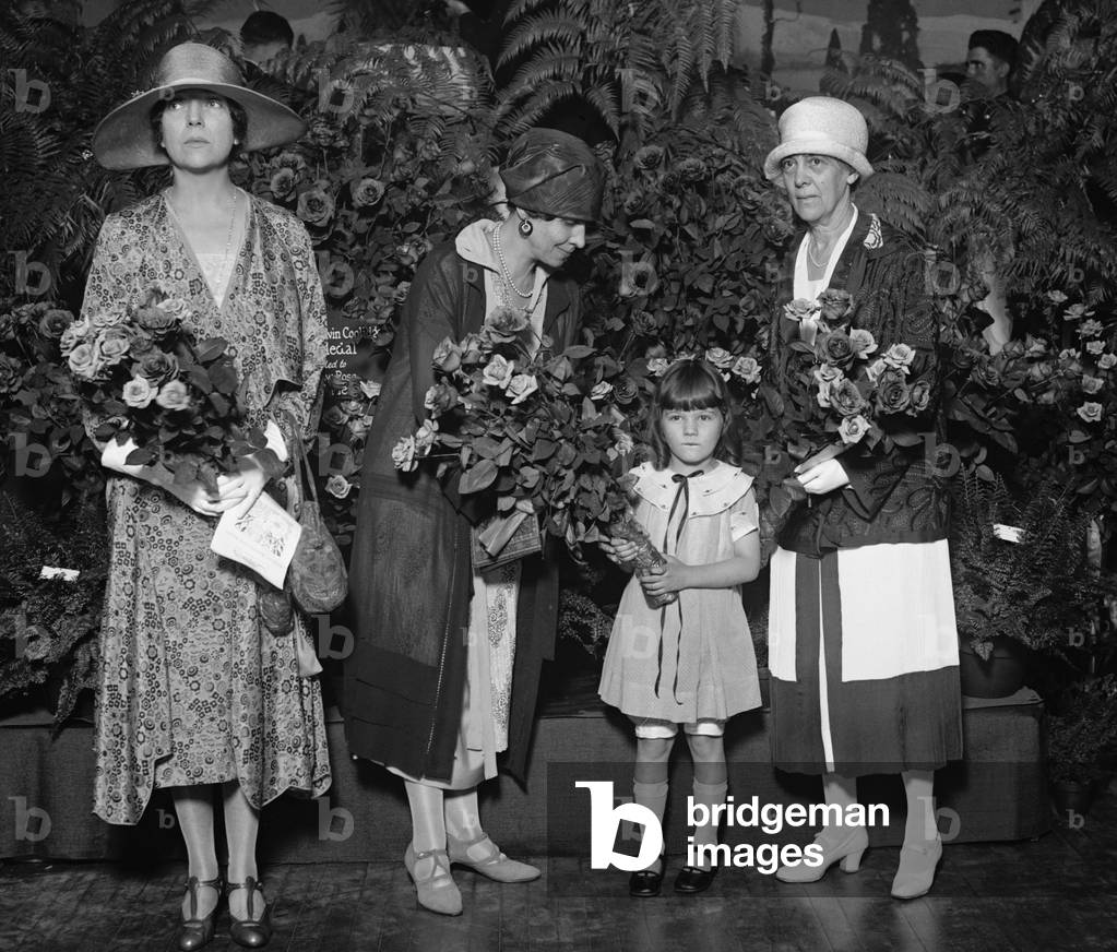 Group portrait of prominent Republican political wives in 1926. Right to left, Mrs. Alice Roosevelt Longworth, Mrs. Coolidge, Lynda Bisset(child) and Mrs. Dawes