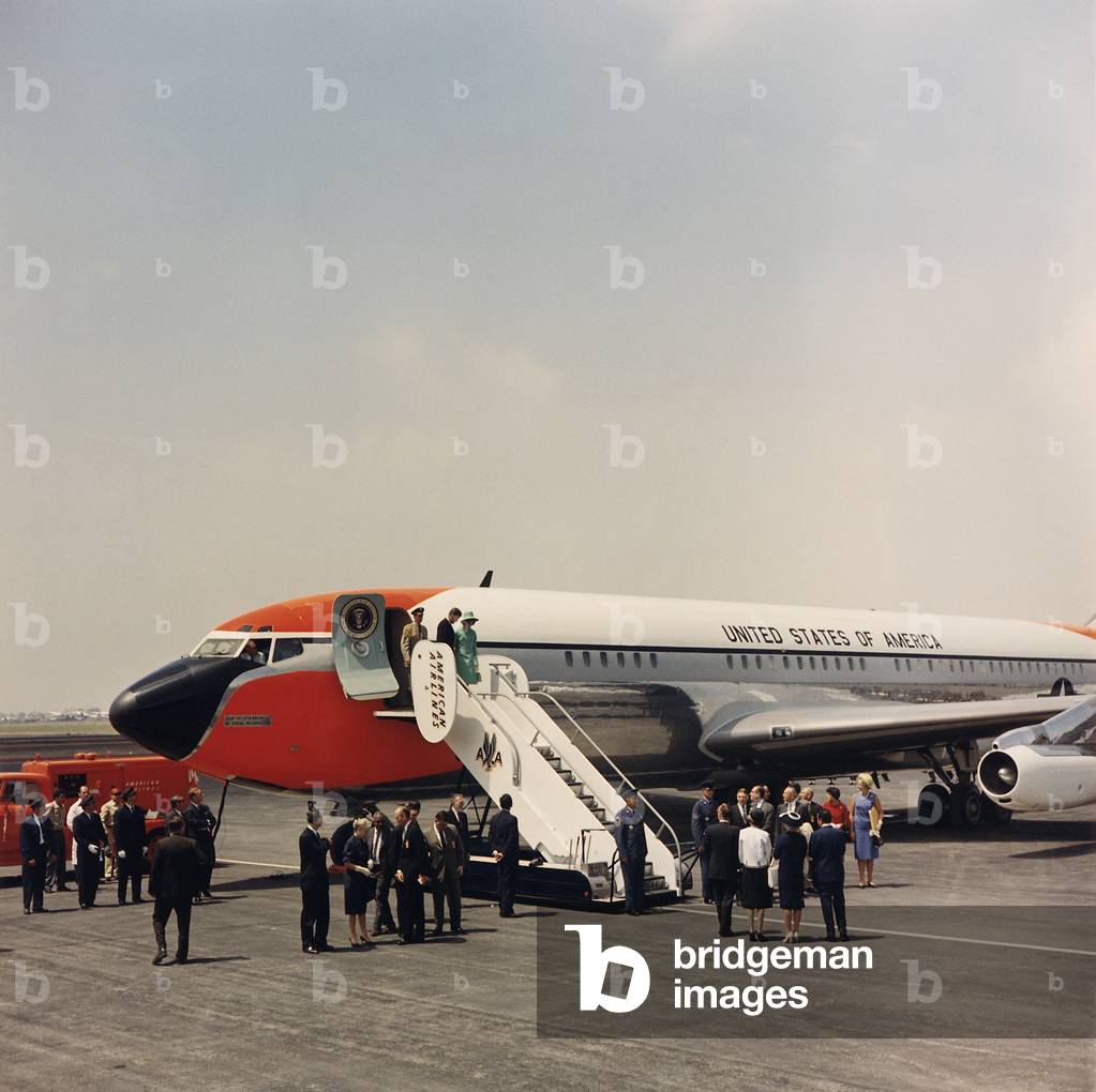 President and Mrs. Kennedy about to leave Air Force One in Mexico City. Jan. 29, 1962
