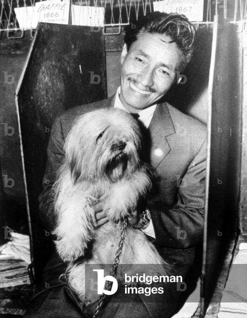 Tensing Norkay with his dog, at a dog show, 11/1/57