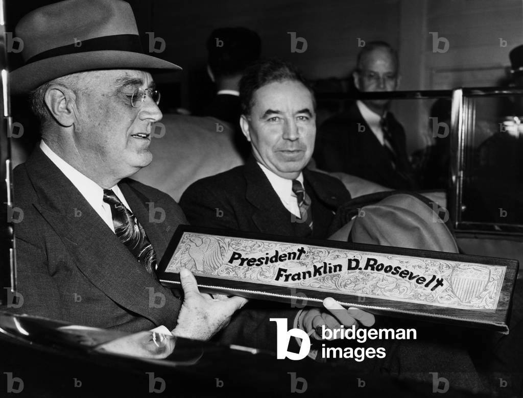 President Franklin D. Roosevelt, and Kansas Governor Andrew Schoeppel, with a gift of his name engraved in leather presented to him at Fort Riley, Kansas, April 29, 1943