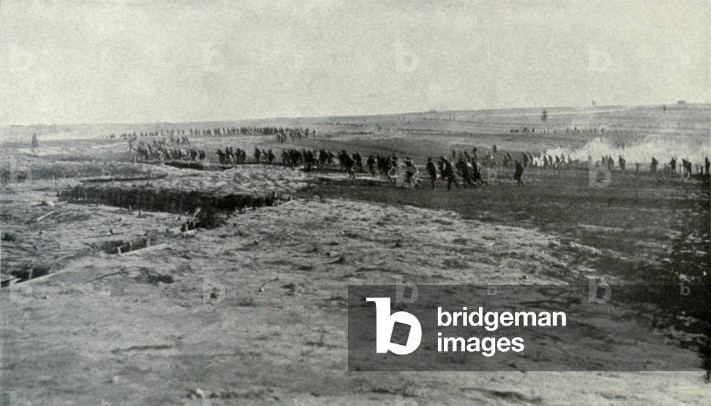 Russian WW1 soldiers deserting first line trenches in July 1917. A regiment has evacuated its first line, rushing back through the reserve wire, to the vacant second line. Their retreat was hastened by rifle grenades from the Germans