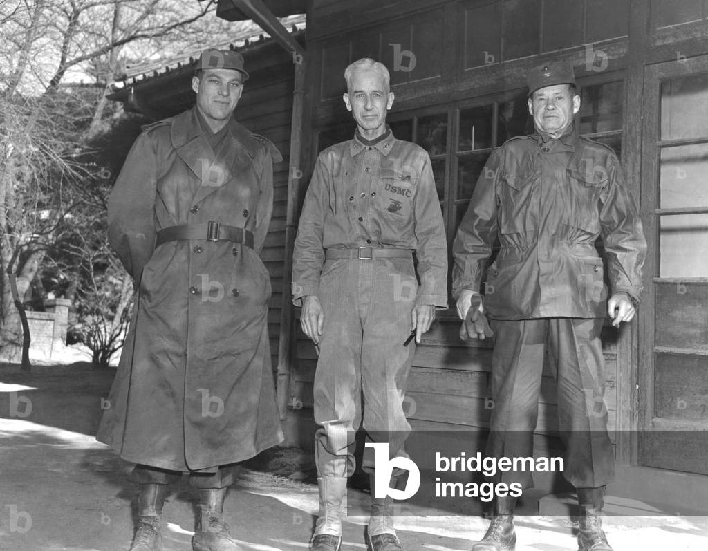 Major General Oliver Smith with Lieutenant Colonel Ray Murray, left, and Colonel Lewis Puller, right, Christmas, 1950. These three seasoned commanders lead their troops wisely in the face of unrealistic ambitions of the senior commanders Major Gen. Ned Almond and Commander in Chief, Douglas MacArthur. Korean War, 1950-53