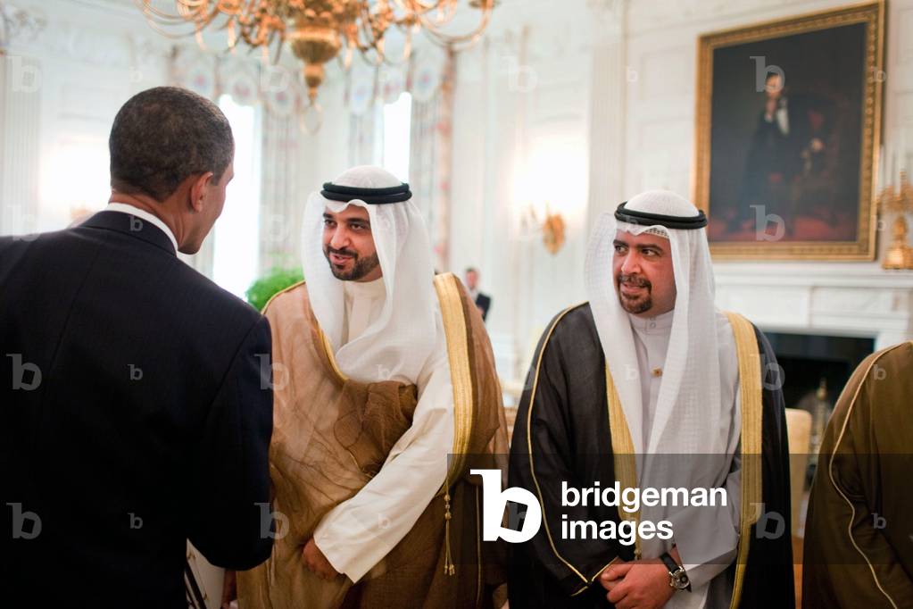 President Obama greets members of the delegation traveling with Sheikh Sabah the Amir of Kuwait during a lunch in the Old Family Dining Room of the White House on Aug. 3 2009. (BSWH_2011_8_253)