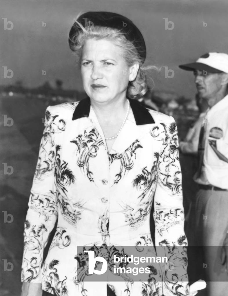 A somber Jacqueline Cochran, owner of the P-51C Mustang, that crashed in the Thompson Trophy Race. Sept 5, 1949. Pilot Bill Odum was killed, as were a young mother and her toddler, when the plane flew into a house in Berea, a suburb of Cleveland. The fatal crash contributed to the air races suspension. -
